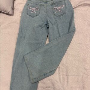 Stylish Blue Jeans with Pink Bow Accents